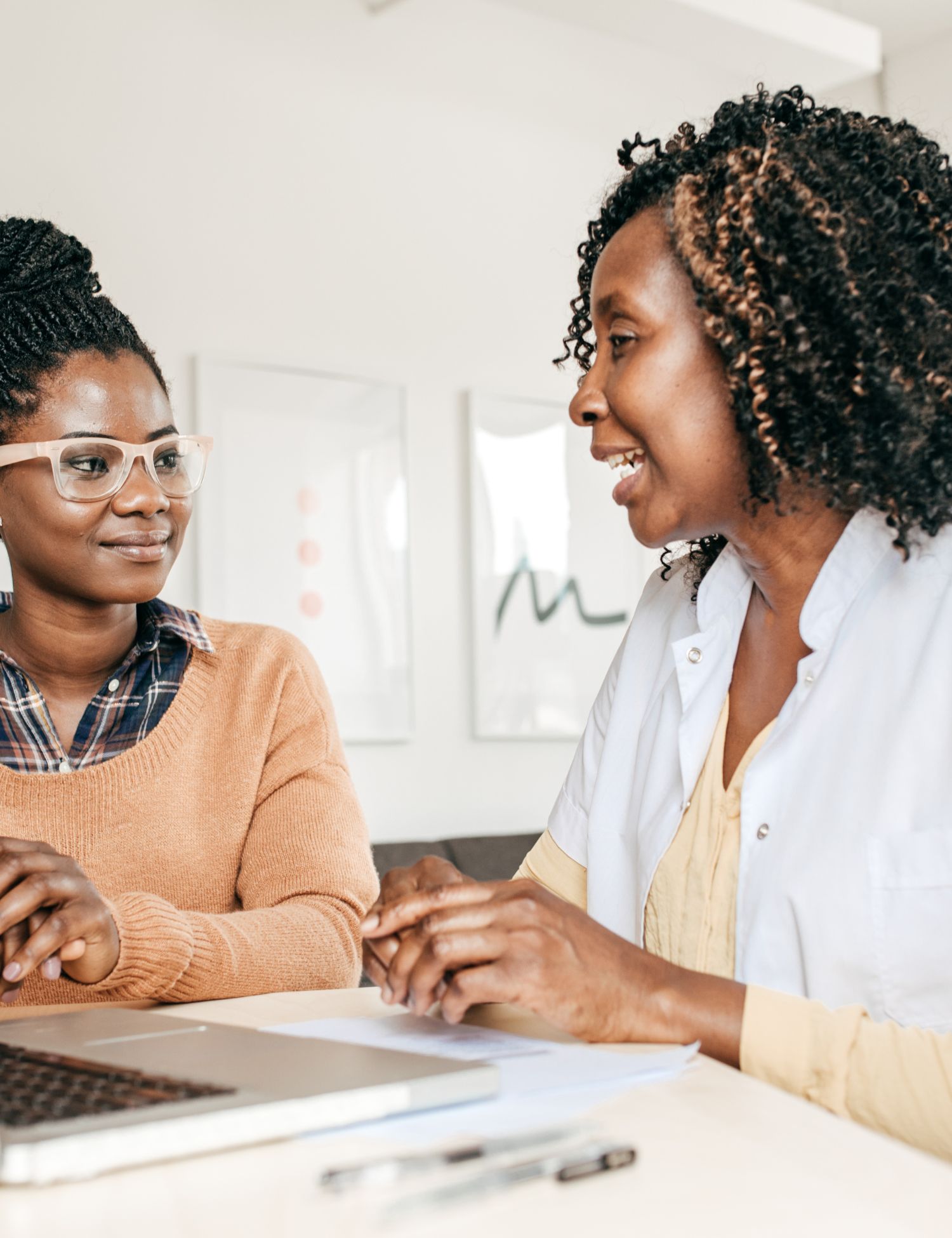 two african american woman talking